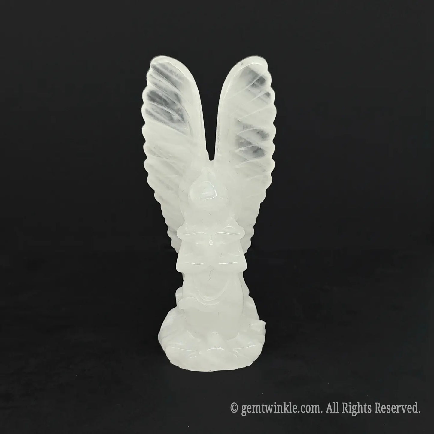 Front view of an icy white clear quartz archangel statue perfect for spiritual healing and meditation altars
