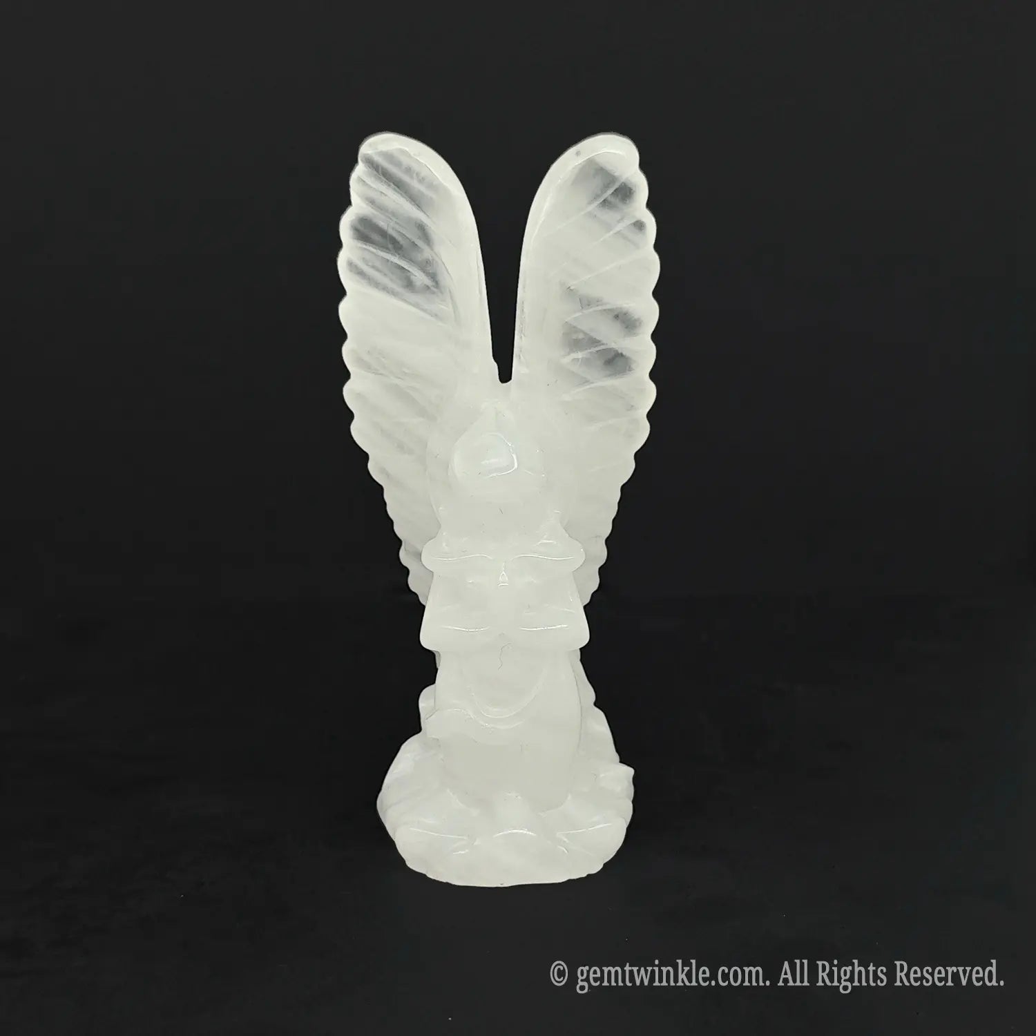 Front view of an icy white clear quartz archangel statue perfect for spiritual healing and meditation altars