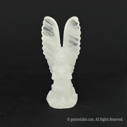 Front view of an icy white clear quartz archangel statue perfect for spiritual healing and meditation altars
