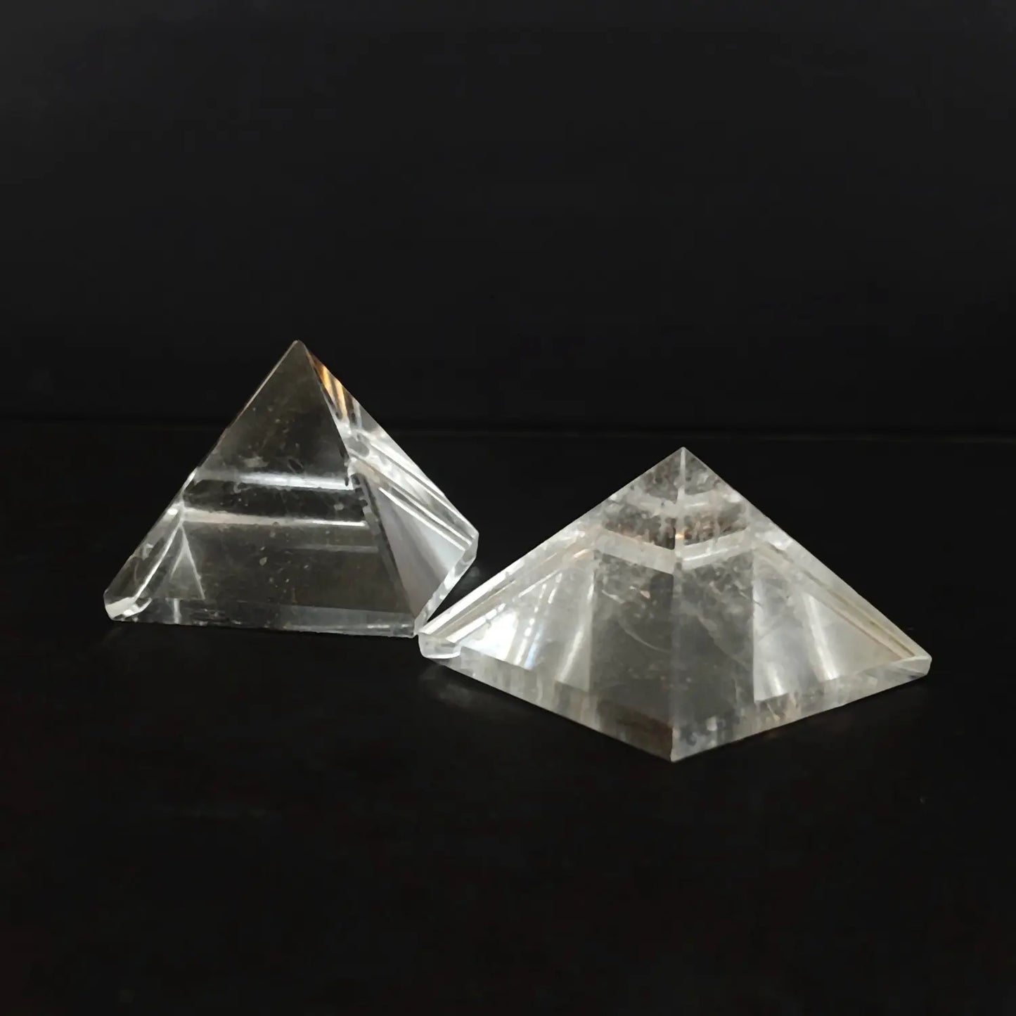 Two natural clear quartz pyramids showing internal ice cracks and cotton inclusions as shown in image_283580.jpg
