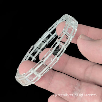 Clear quartz 3d pyramid faceted square bead cuff bracelet side view displaying crisp geometric angles and high polish