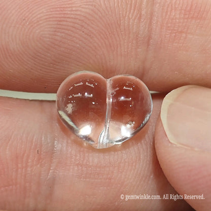 Clear quartz puffy heart focal bead vertical hole detail showing top to bottom drill line for threading wire or cord
