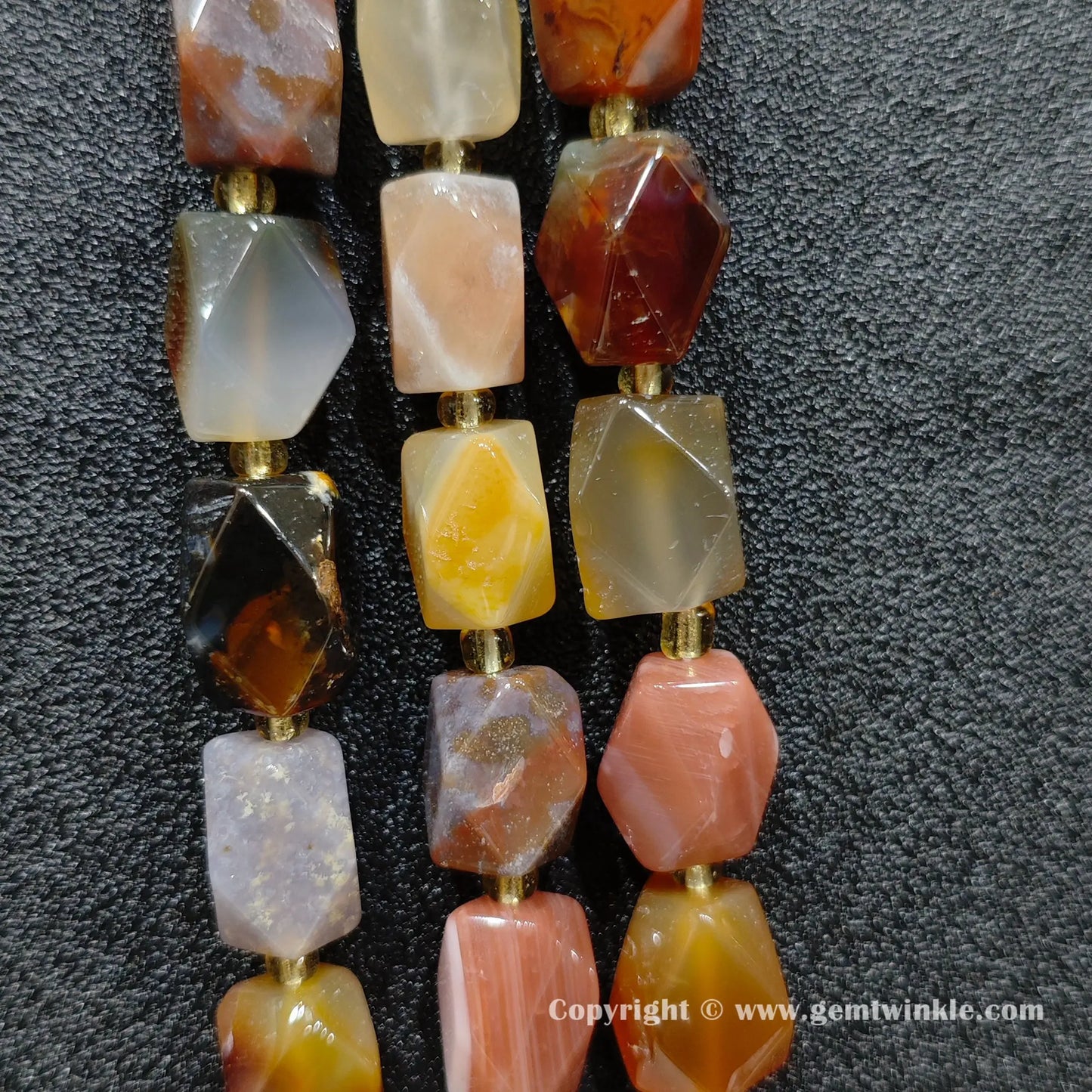 close up of ocean agate cylinder beads showing natural banding and translucent layers