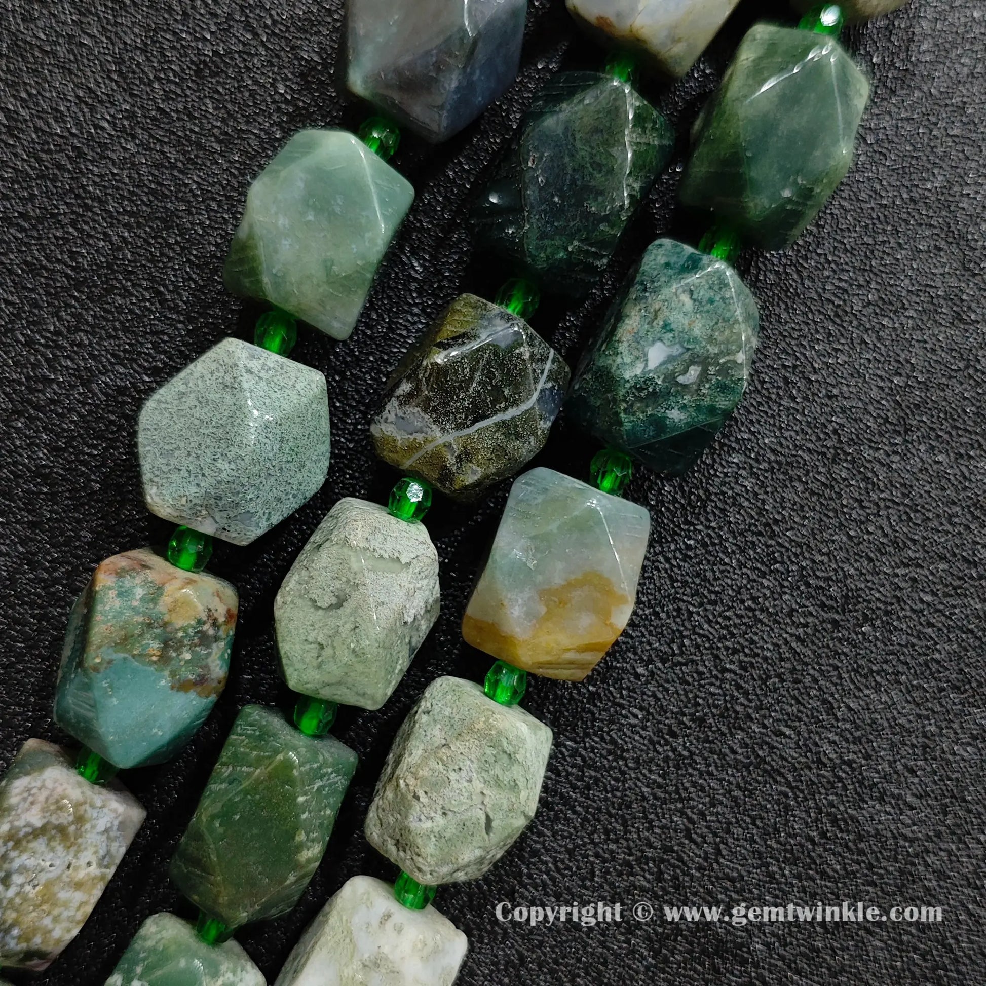 close up of orbicular green ocean jasper faceted cylinder stone