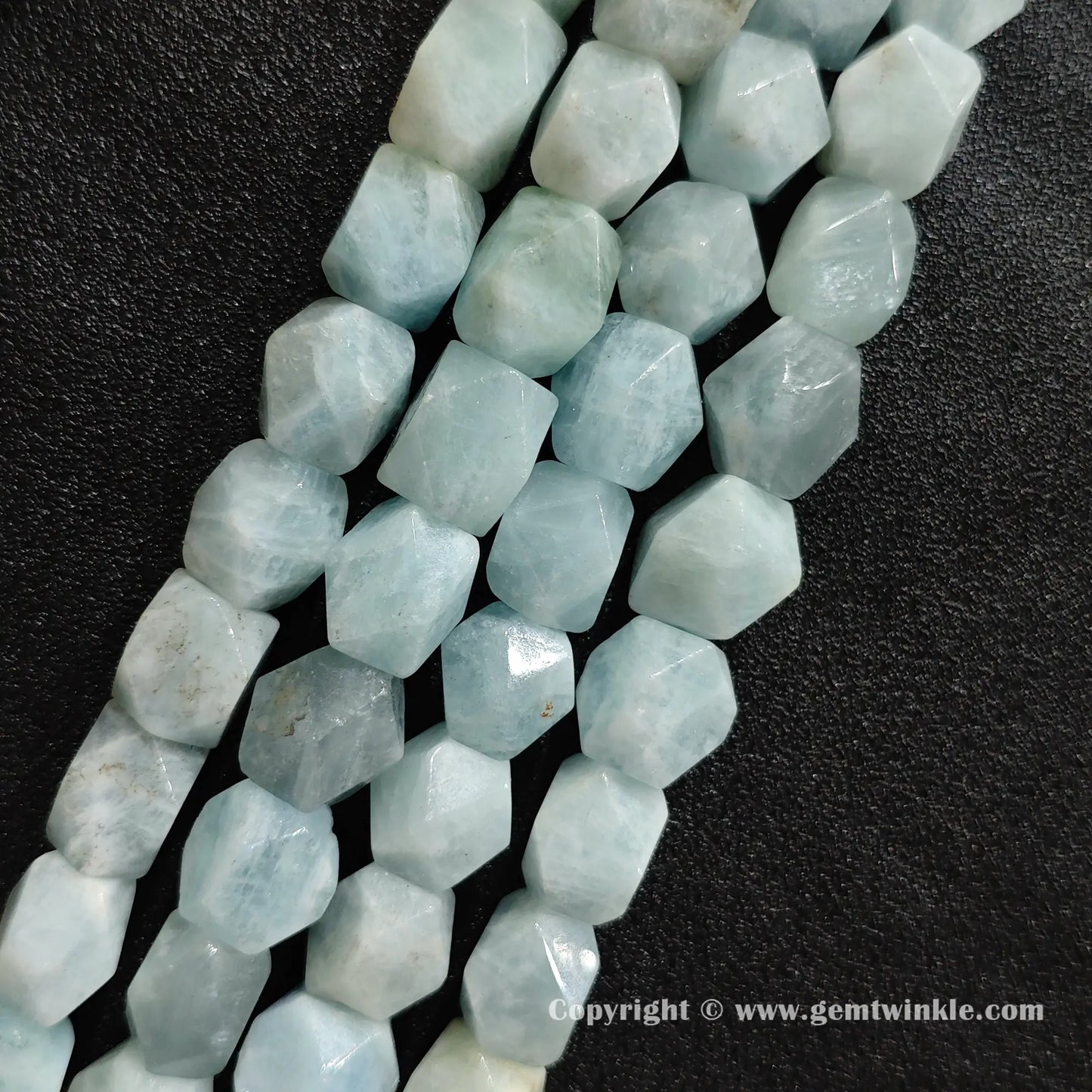close up sky blue aquamarine geometric cylinder stone beads