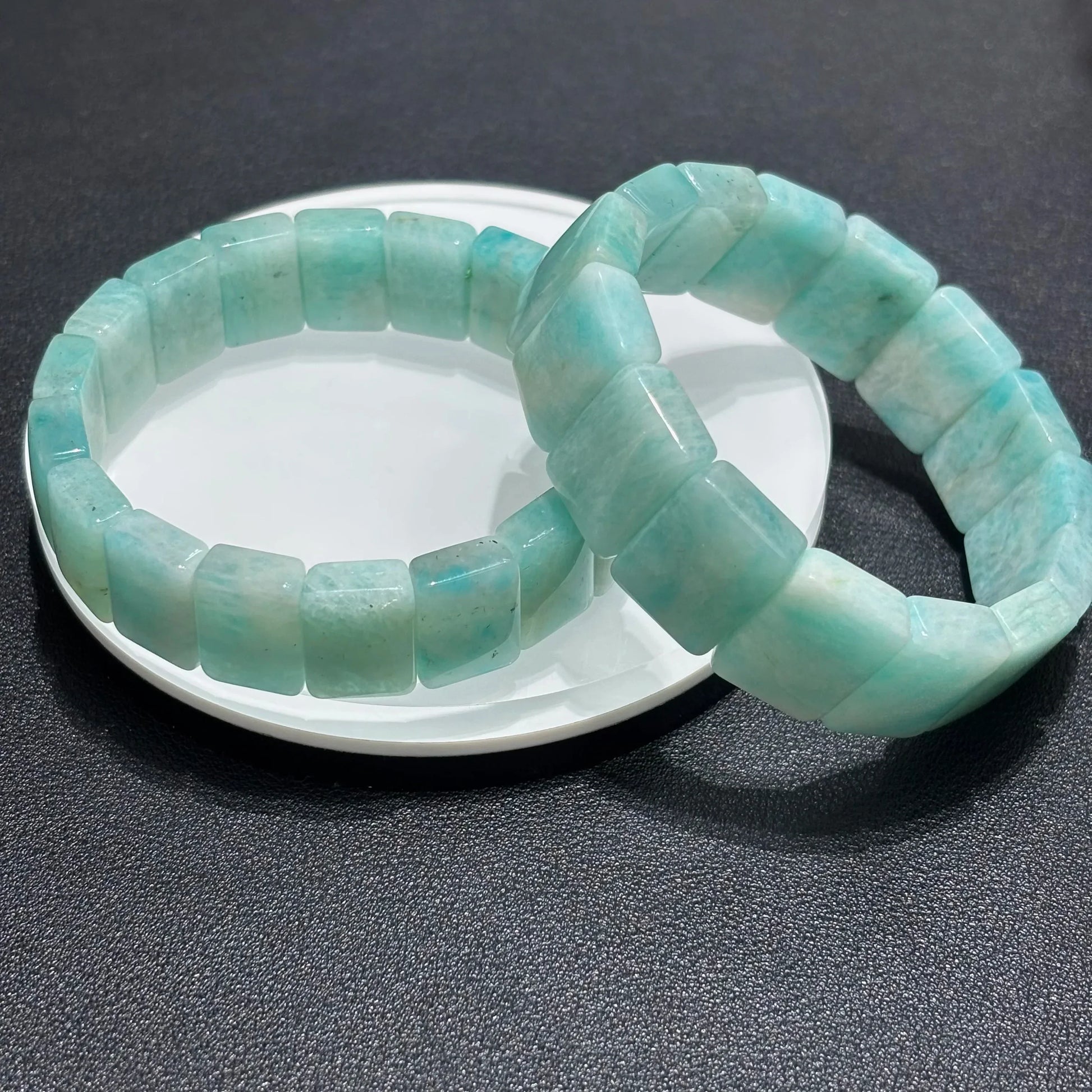 Close-up view of the Natural Amazonite Bangle, focusing on the geometric square bead shape and natural stone patterns.