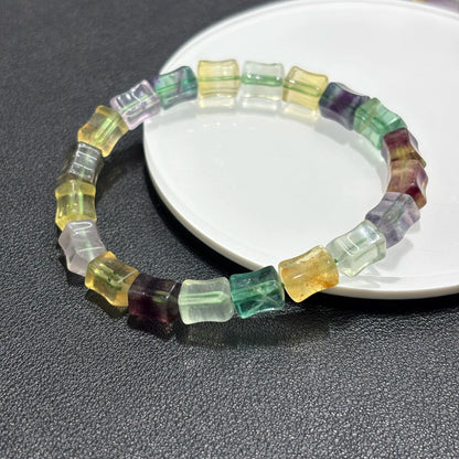 Closeup view of the natural fluorite beads, showing the intricate details and crystal clarity of the multicolor bamboo beads.