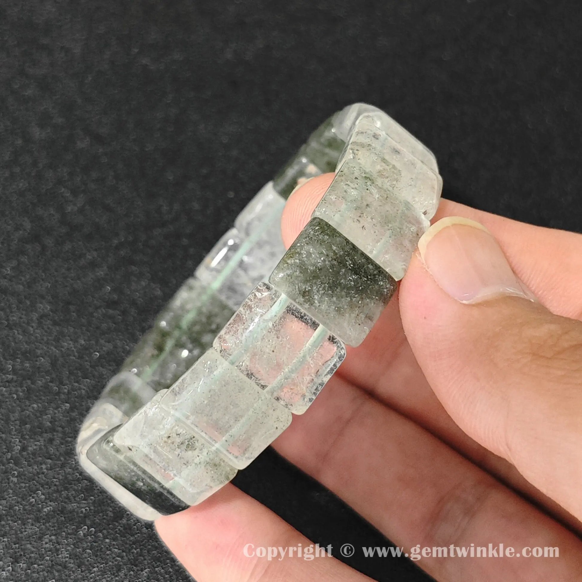side profile of machine polished cloud phantom quartz plate bracelet showing beveled edges