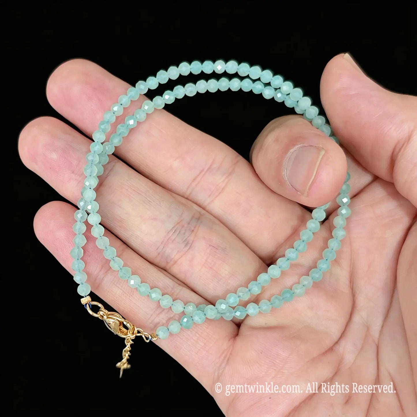 convertible amazonite wrap bracelet displayed across open hand showing 40cm length