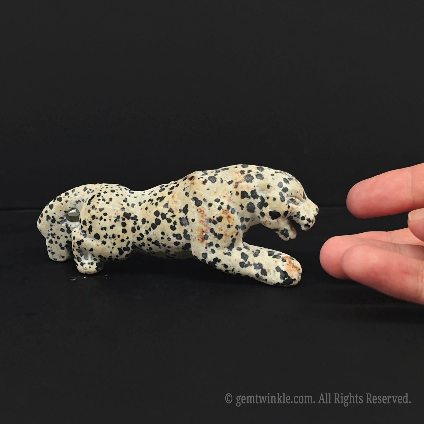 Side view of hand carved dalmatian jasper leopard figurine showing premium stone craftsmanship from donghai wholesale crystal market