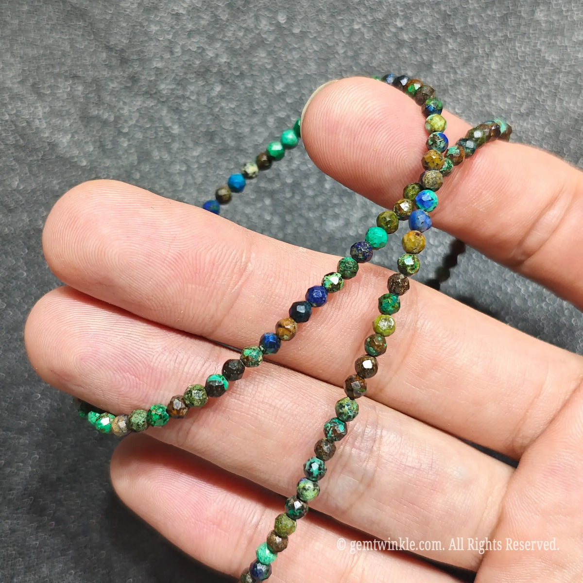 Detailed view of 3mm micro faceted azurite malachite necklace showing multi angle earth stone light reflections