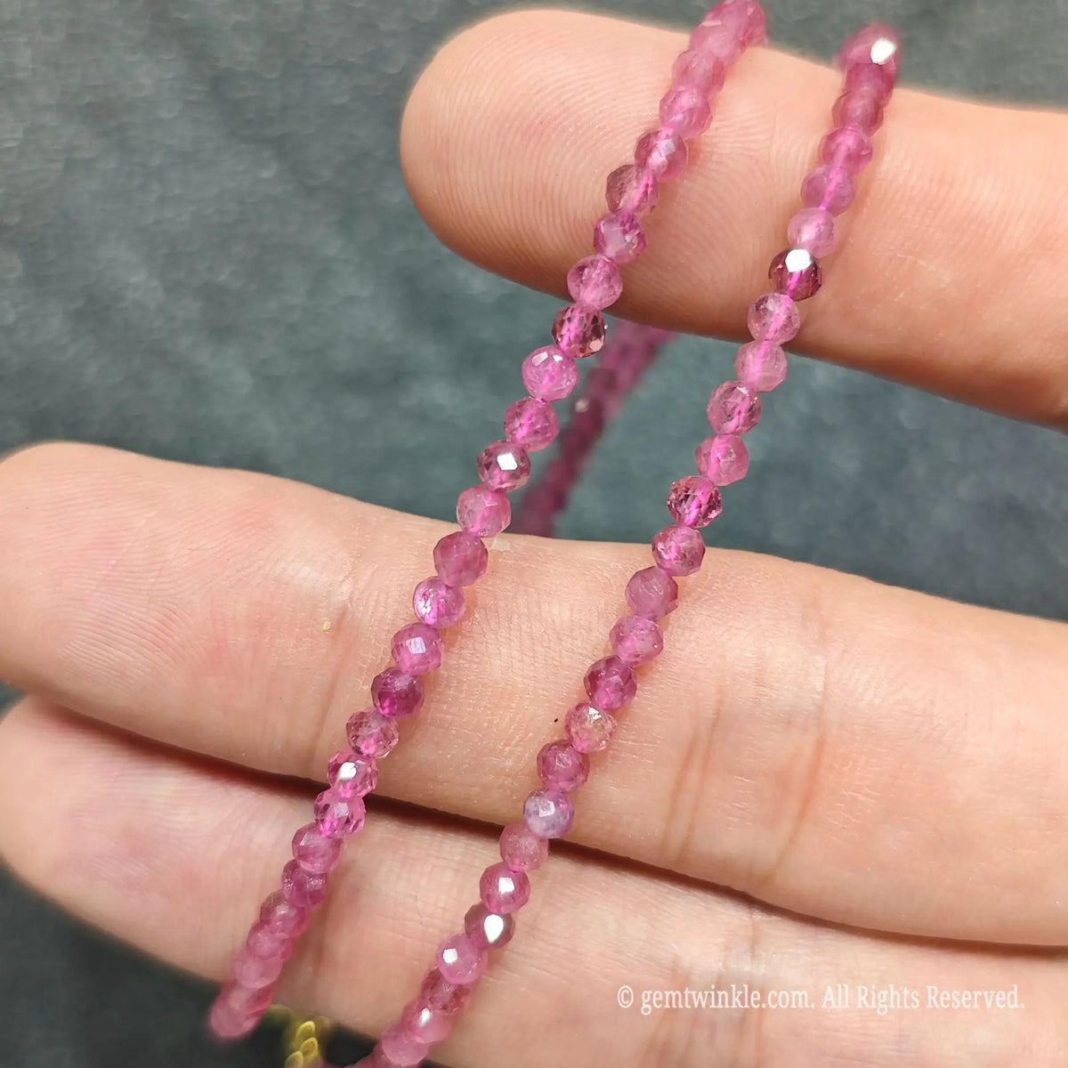 Detailed view of 3mm micro faceted pink tourmaline necklace showing multi angle sparkle and rosy clarity
