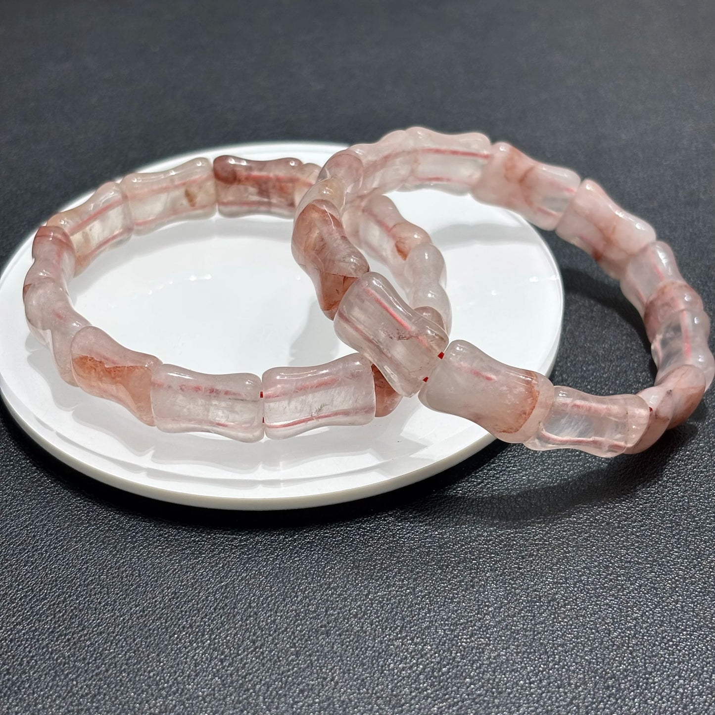 Double layer red quartz bamboo bracelets styled for a stackable look.