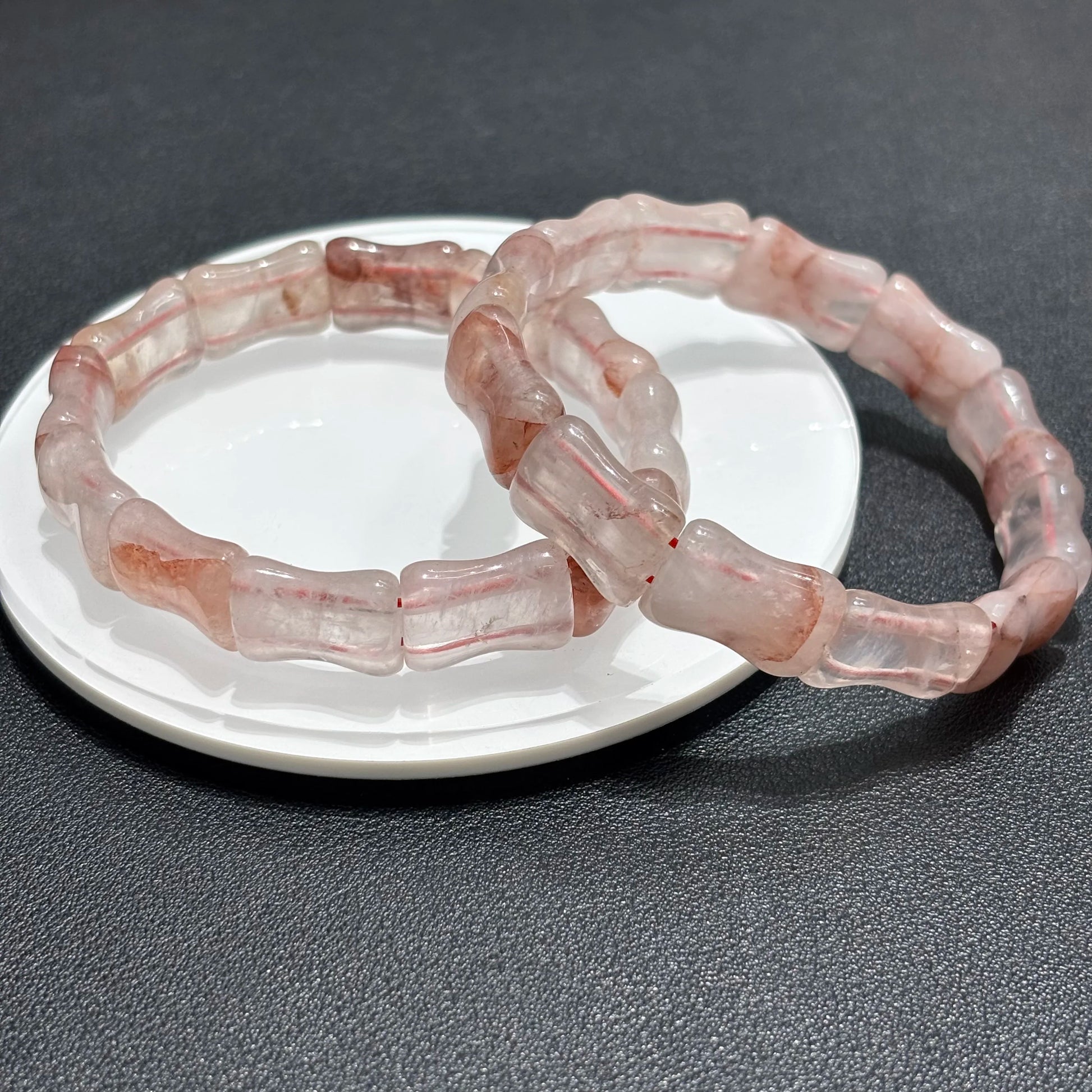 Double layer red quartz bamboo bracelets styled for a stackable look.