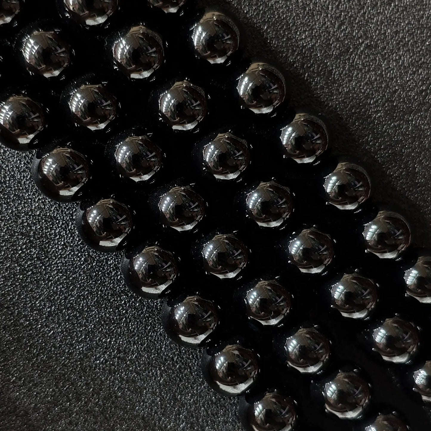 Close up of glossy Dyed Black Agate round beads for jewelry making