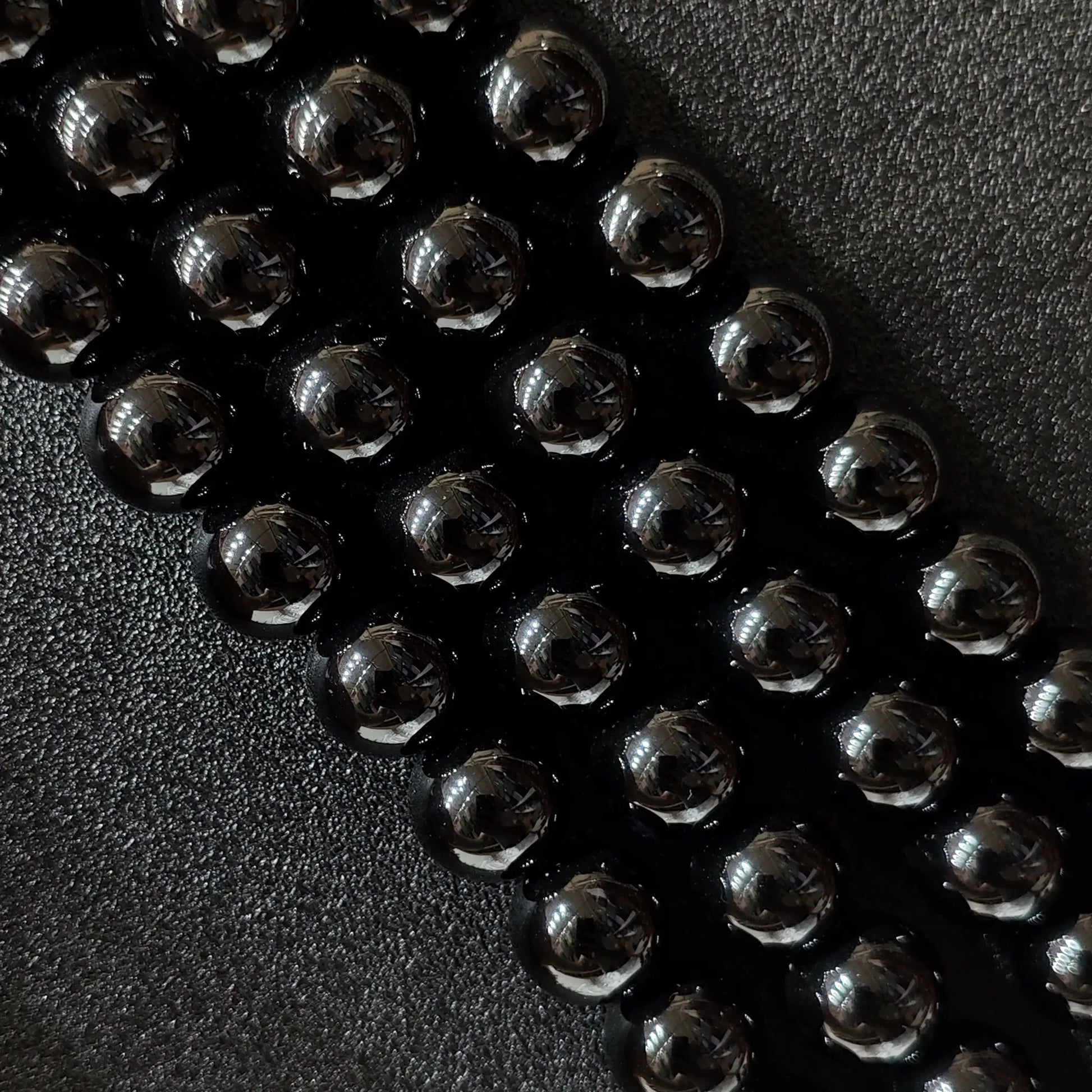 Close up of glossy Dyed Black Agate round beads for jewelry making