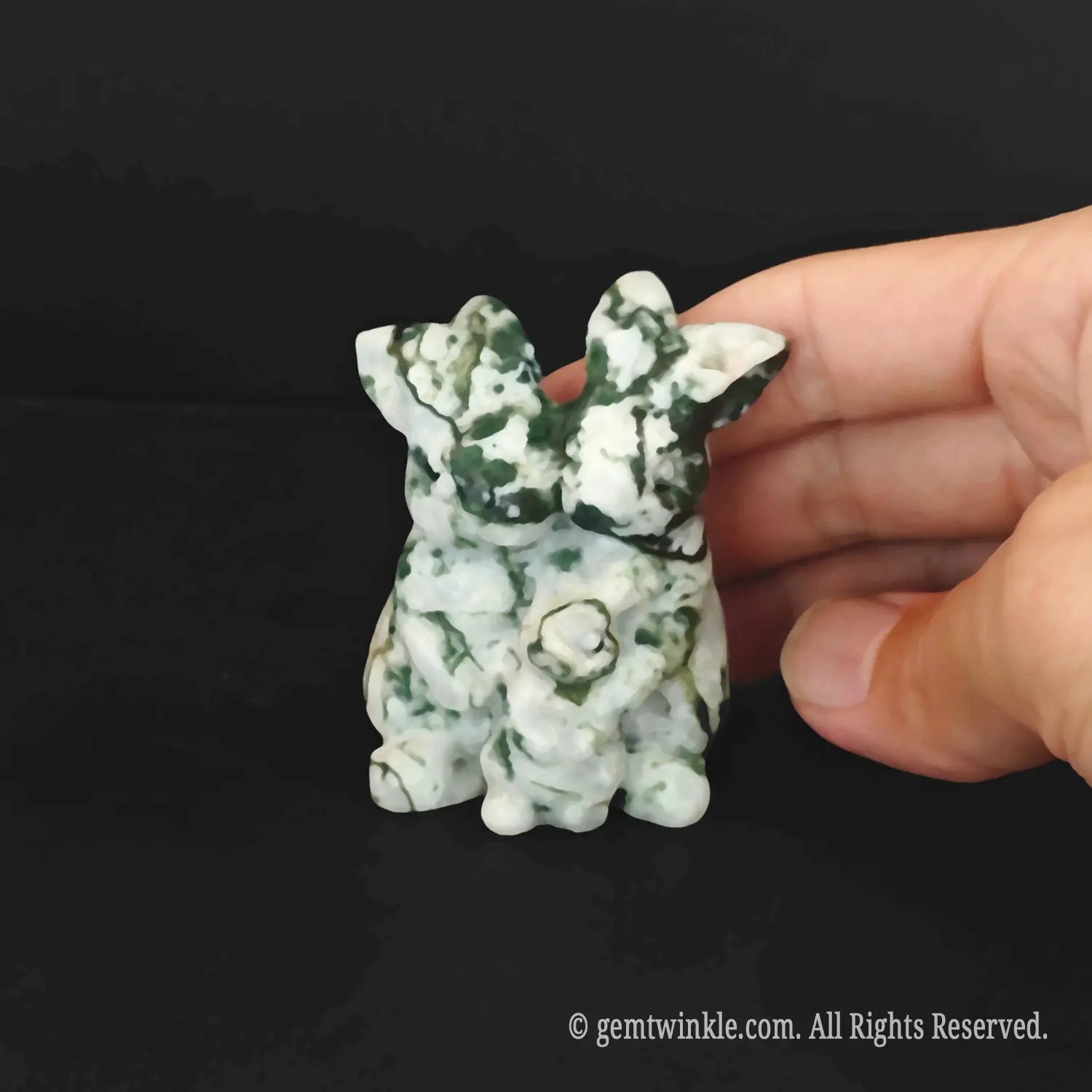 Genuine unheated moss agate crystal carving featuring family of 3 parent and child rabbits held for order verification
