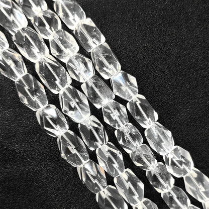 Strand of B-grade natural clear quartz faceted freeform barrel beads 15mm