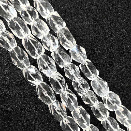 Strand of B-grade natural clear quartz faceted freeform barrel beads 15mm