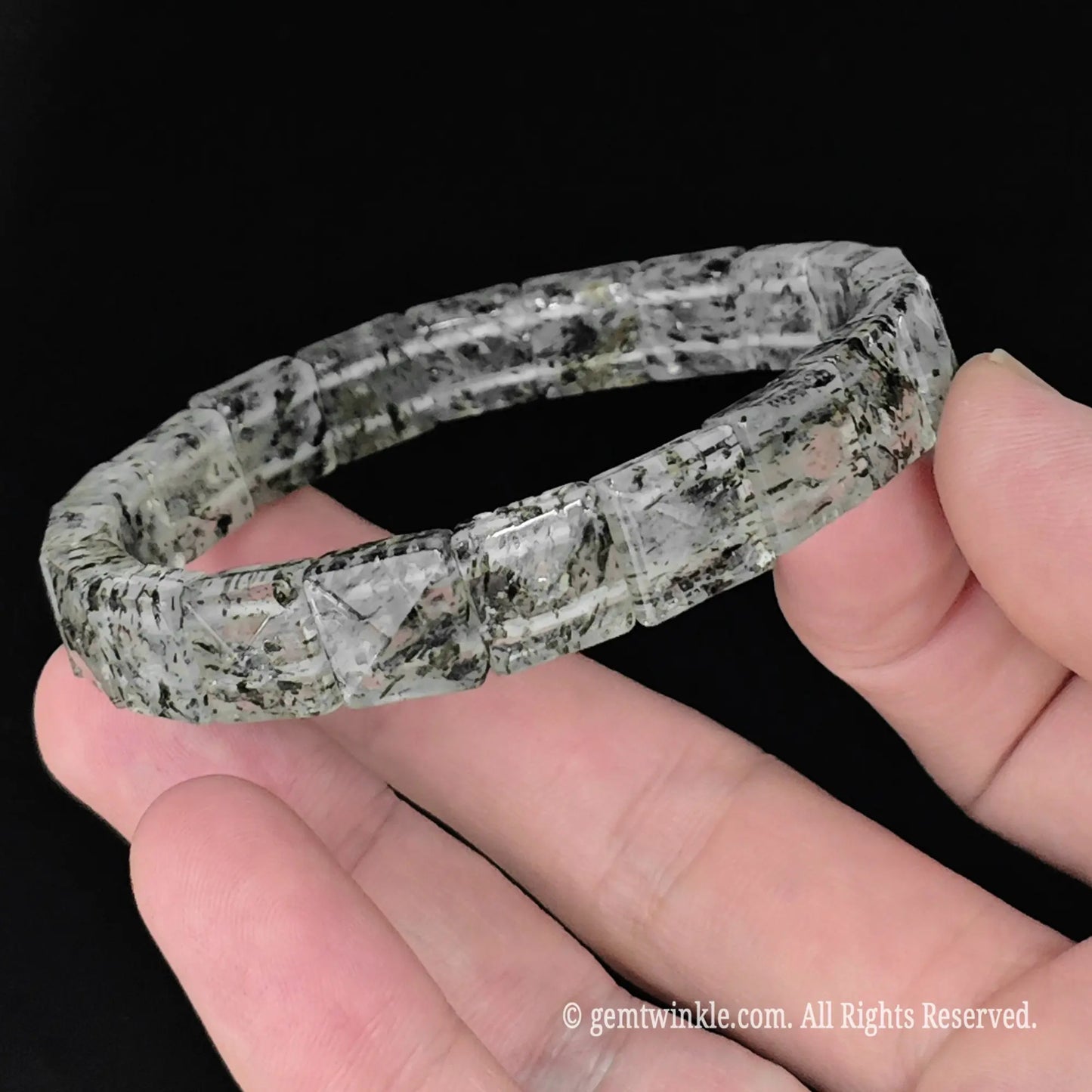 side view of 10mm pyramid faceted green mica clear quartz segment stretch bracelet