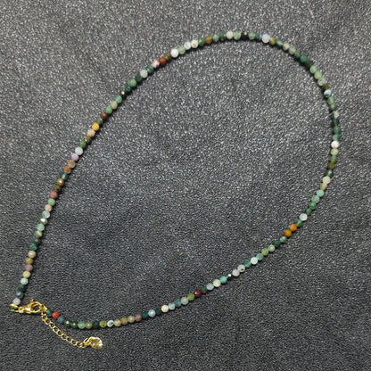 Faceted ocean jasper gemstone necklace strand with 3mm beads and gold extension chain layout