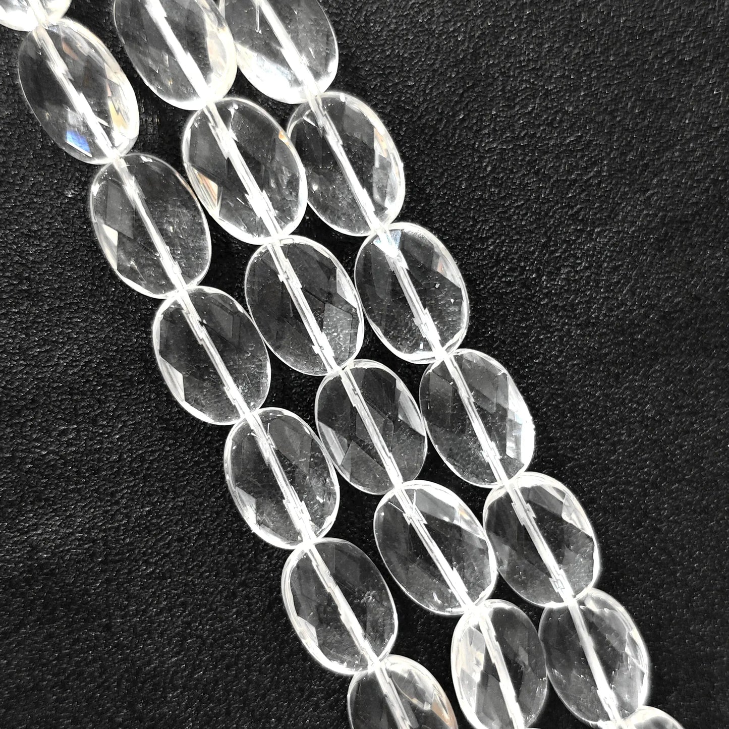 Strand of B-grade natural clear quartz faceted oval flat slice beads 13mm