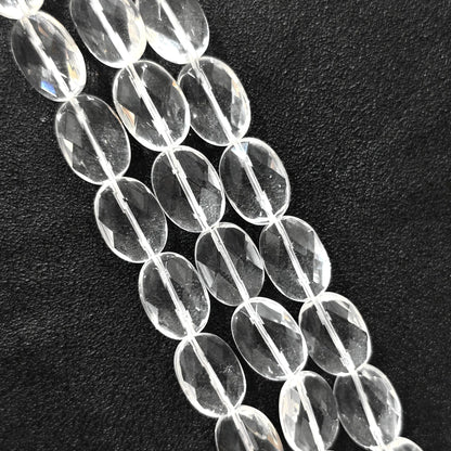 Strand of B-grade natural clear quartz faceted oval flat slice beads 13mm