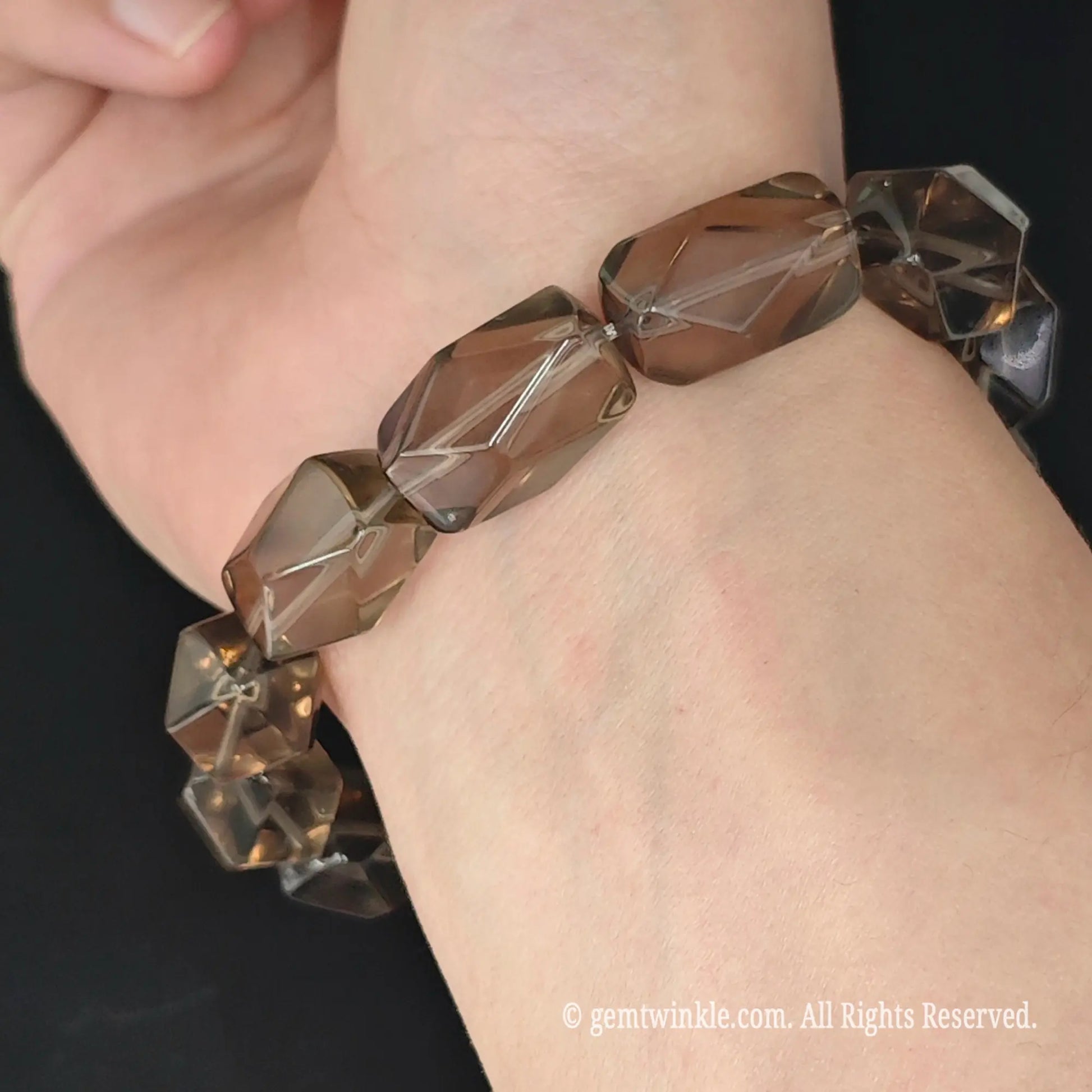 side view of faceted smoky quartz geometric nugget stretch bracelet on wrist