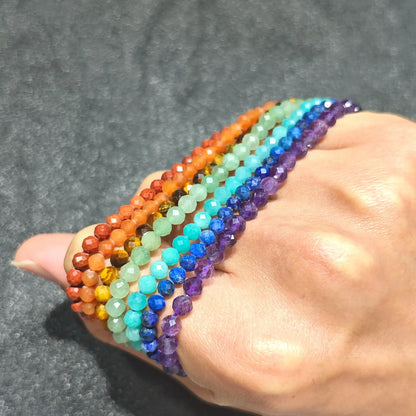 multi gemstone faceted rondelle bead stretch bracelets wrapped around hand showcasing sparkling light reflections