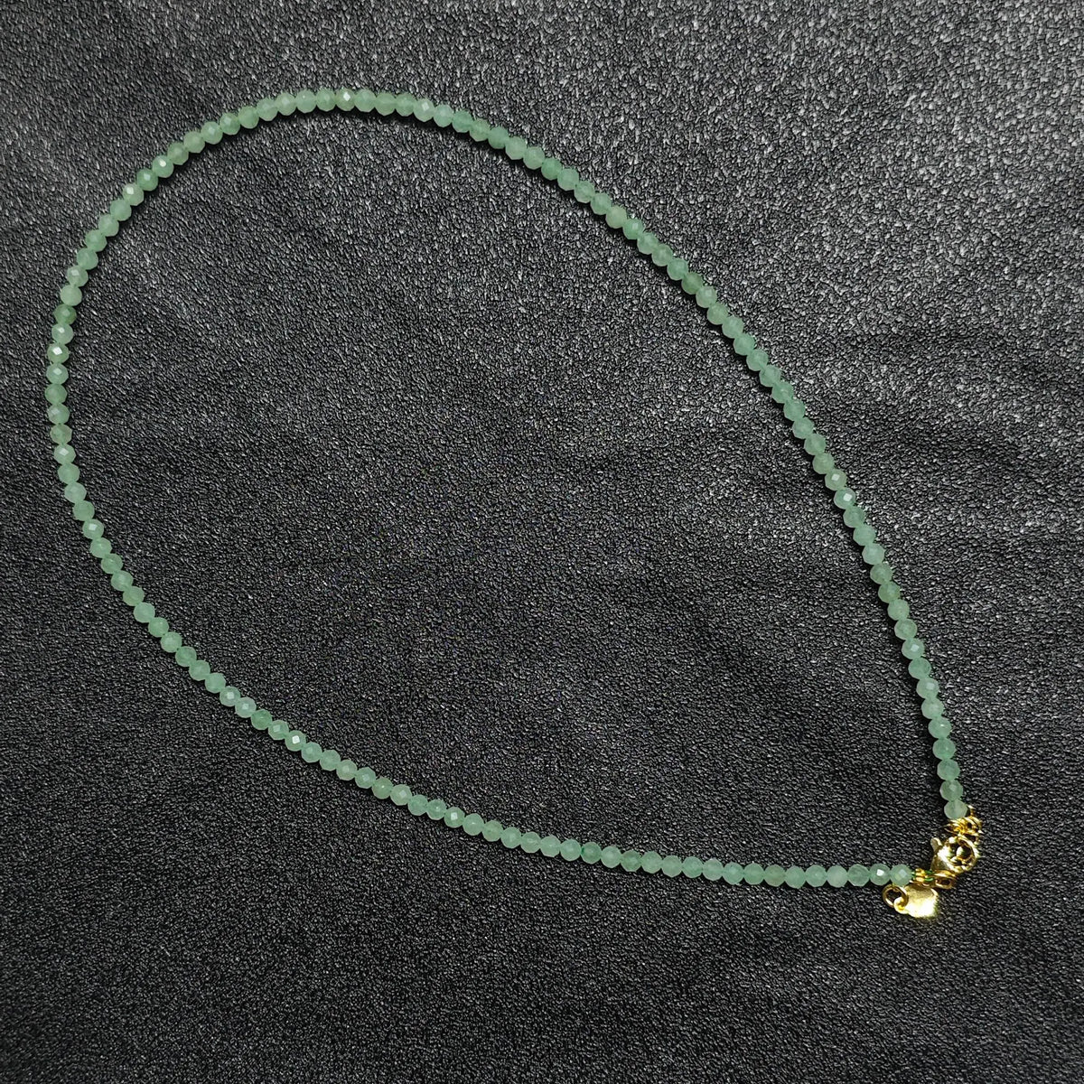 Natural faceted green aventurine necklace with 3mm beads and gold extension chain layout