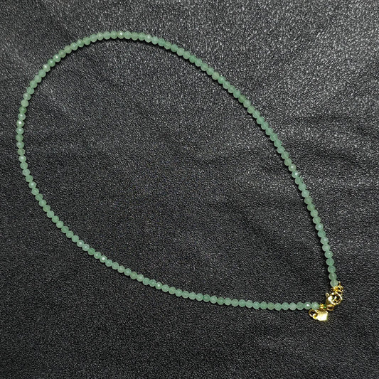 Natural faceted green aventurine necklace with 3mm beads and gold extension chain layout