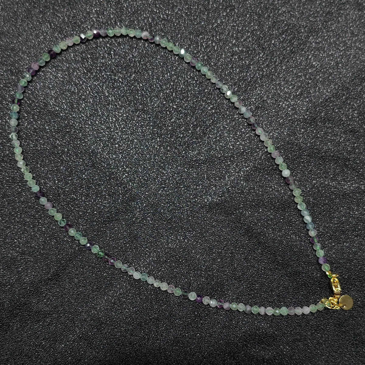 Natural faceted rainbow fluorite necklace with 3mm micro beads and gold extension chain layout