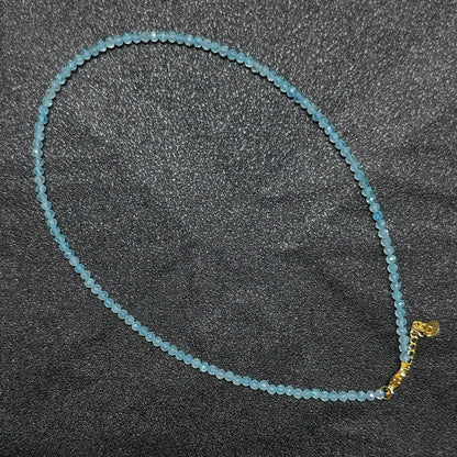 Natural faceted sky blue topaz necklace made with 3mm micro round beads and a gold extension chain