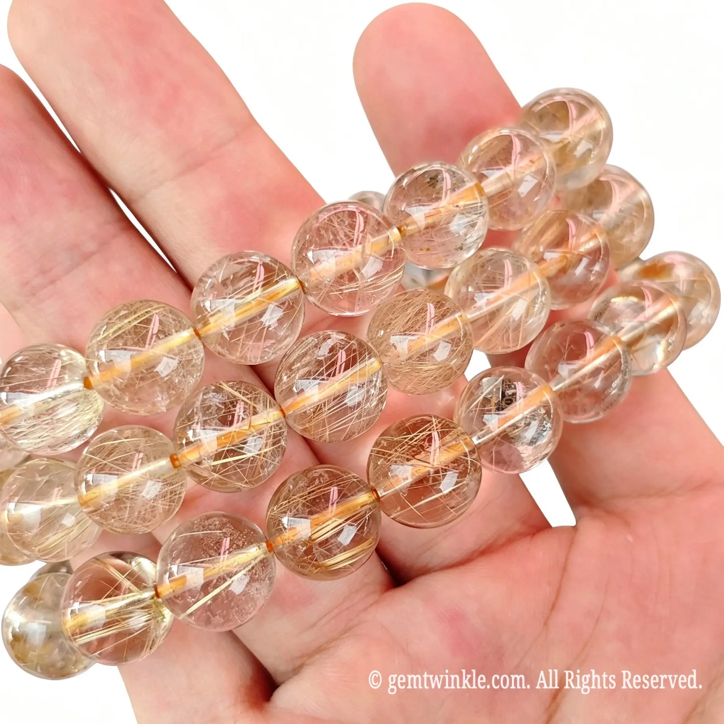 Preview of single-strand fine thread gold rutilated quartz round bead bracelet on elastic cord