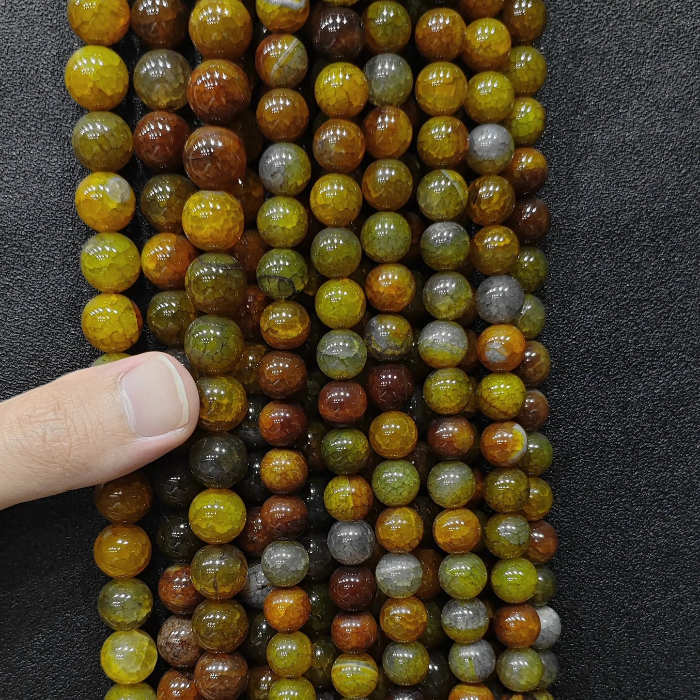 Showing a full set of fire crackled yellow agate loose beads strands for boutique stock verification