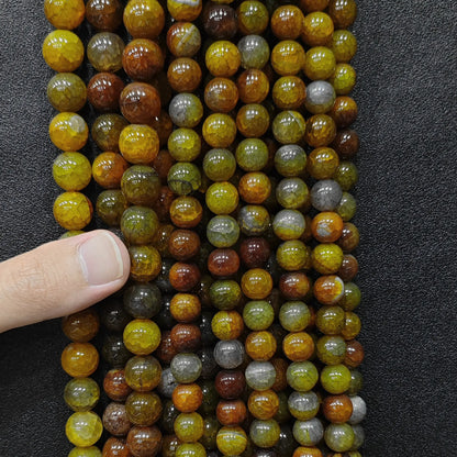 Showing a full set of fire crackled yellow agate loose beads strands for boutique stock verification