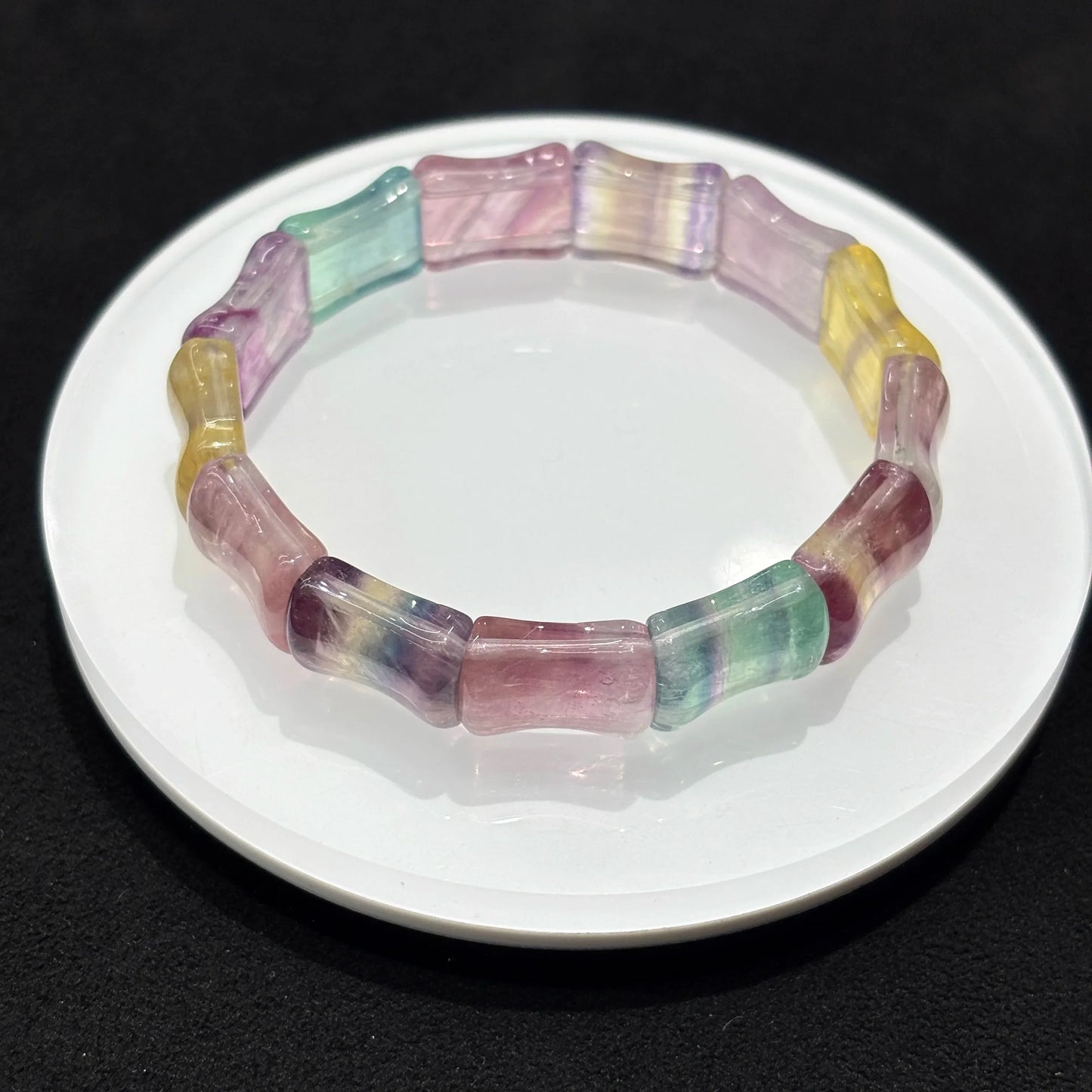  Closeup of Natural Colorful Fluorite Bamboo Bead Bangle Bracelet, detailed view of 13x16mm beads, vibrant purple green yellow pink bands