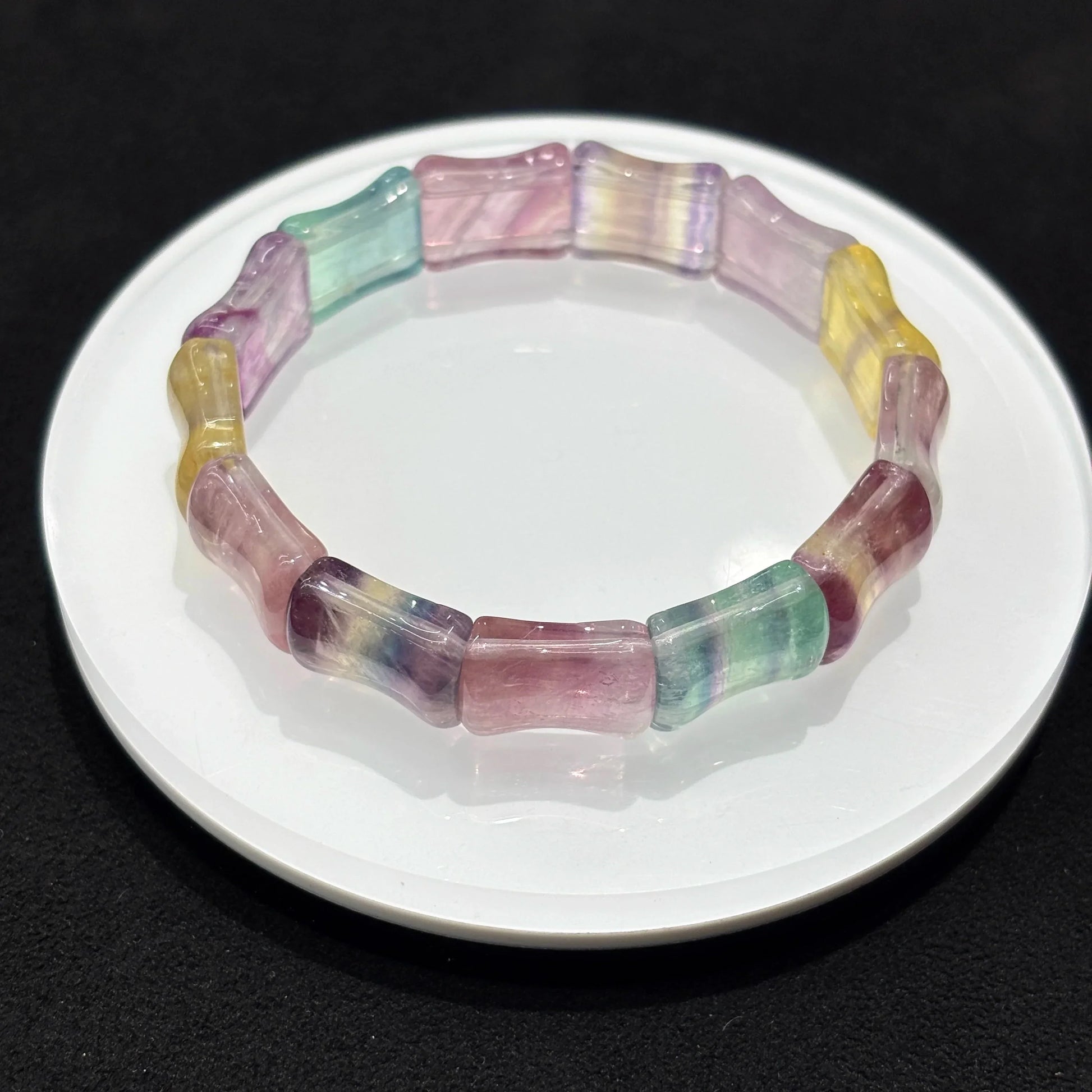  Closeup of Natural Colorful Fluorite Bamboo Bead Bangle Bracelet, detailed view of 13x16mm beads, vibrant purple green yellow pink bands