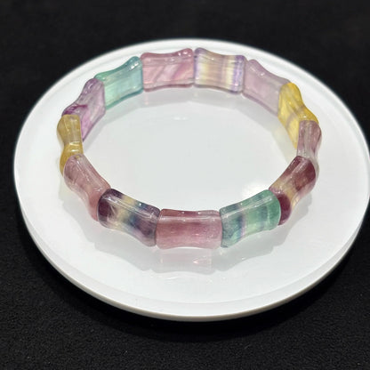  Closeup of Natural Colorful Fluorite Bamboo Bead Bangle Bracelet, detailed view of 13x16mm beads, vibrant purple green yellow pink bands