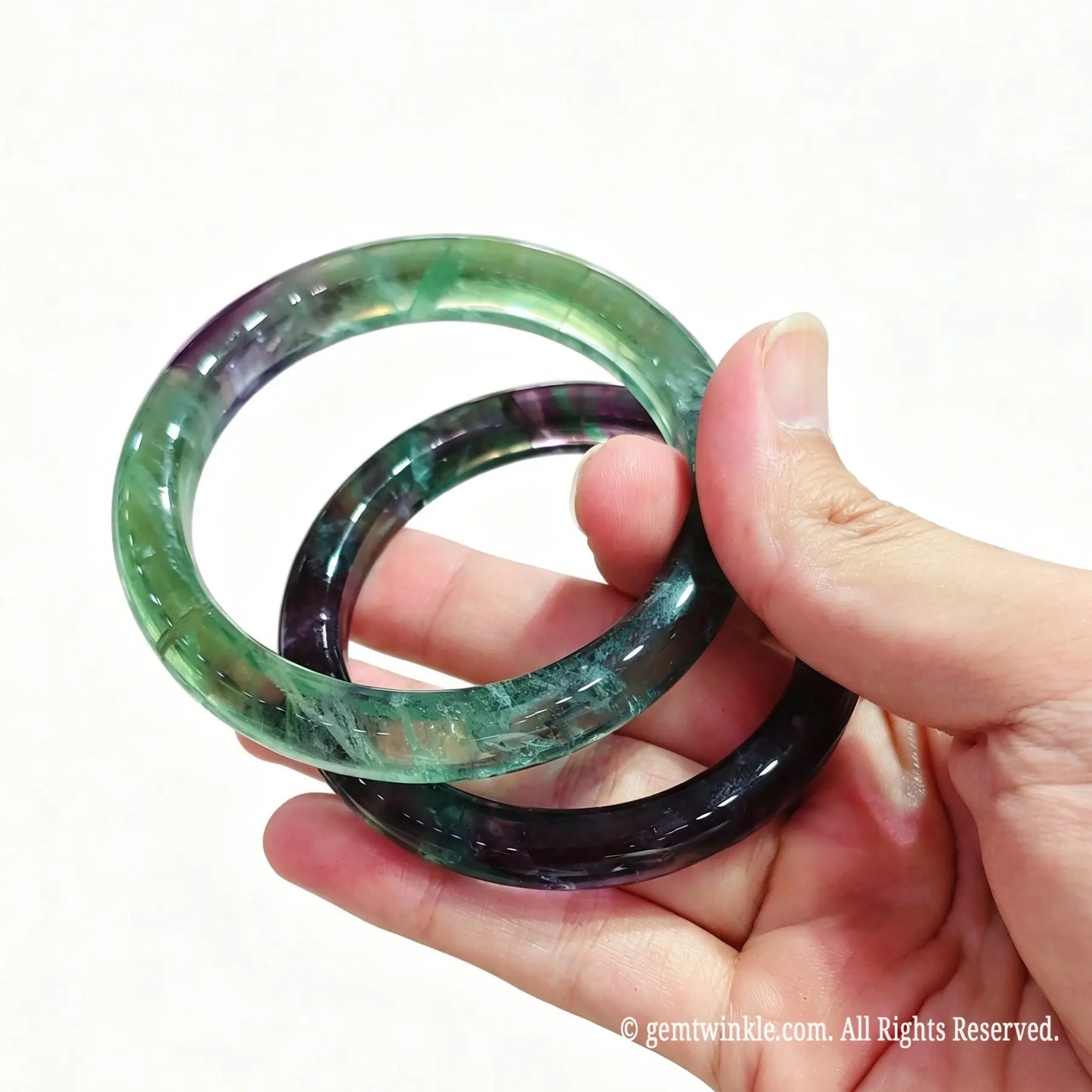 Hand holding fluorite mineral gemstone band ready for live sale inventory and boutique reseller supply