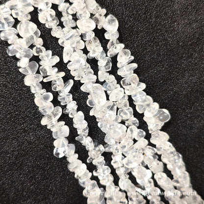 Long strand layout of frosted white cloudy quartz chip beads for jewelry crafting