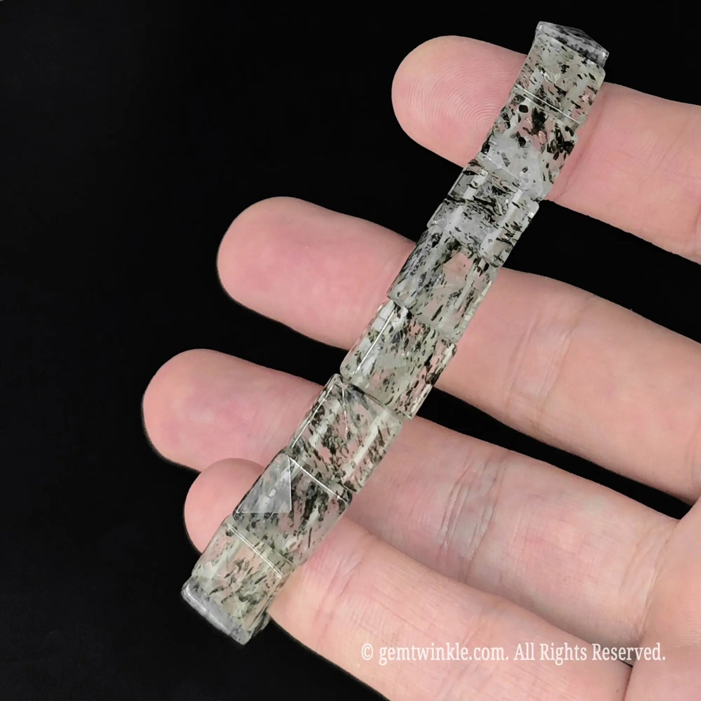 straight top view of 10mm green mica inclusion clear quartz pyramid faceted bead bracelet