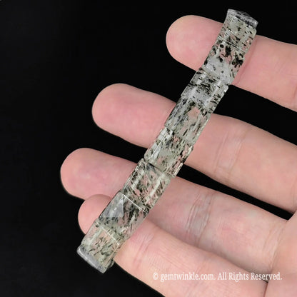 straight top view of 10mm green mica inclusion clear quartz pyramid faceted bead bracelet