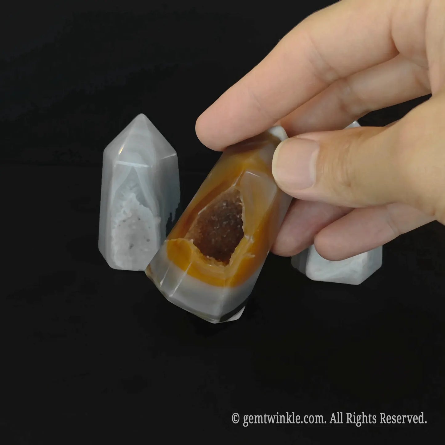 Detailed top angle view of a 5cm carnelian orange geode tower highlighting the deep micro crystalline pocket