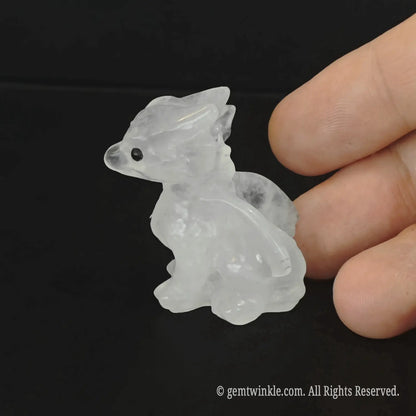 Angled view of a translucent milky quartz baby dragon statue highlighting the frosty white crystalline body structure
