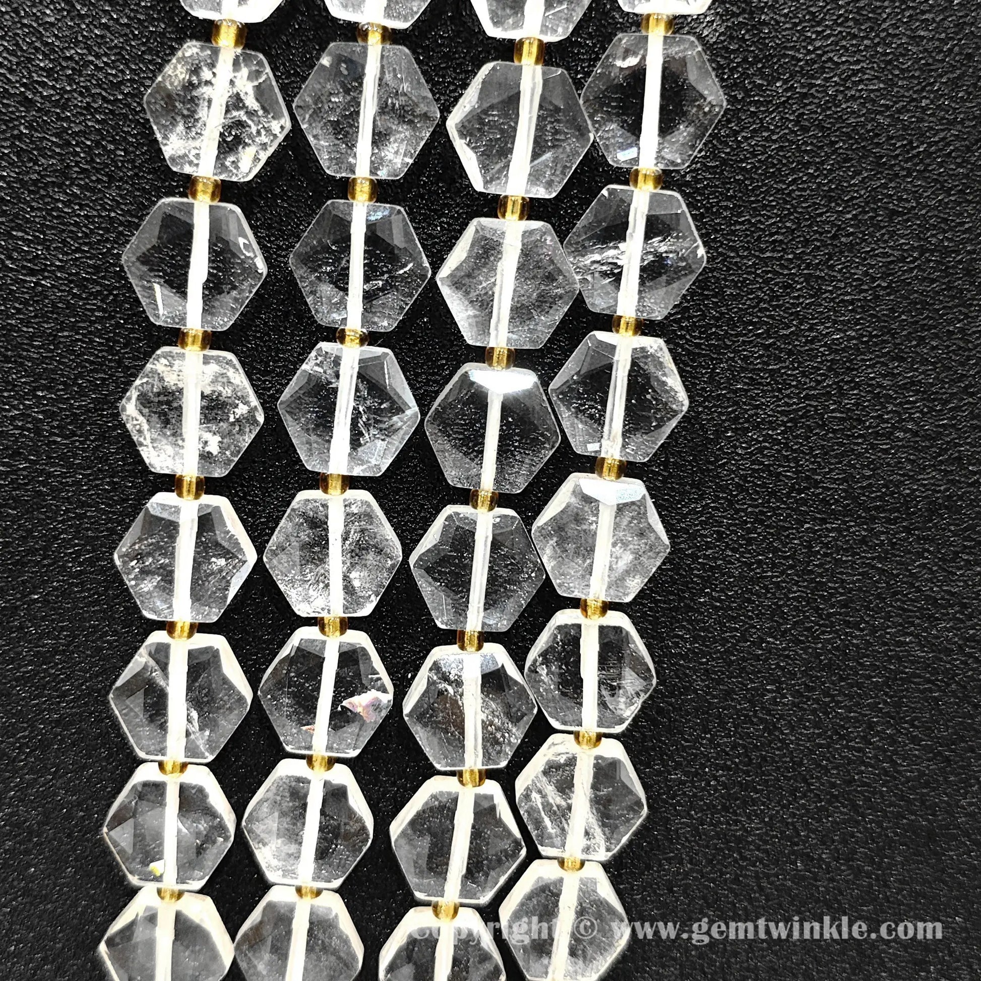 Vertical layout of geometric polygon flat clear quartz beads showing natural inclusions
