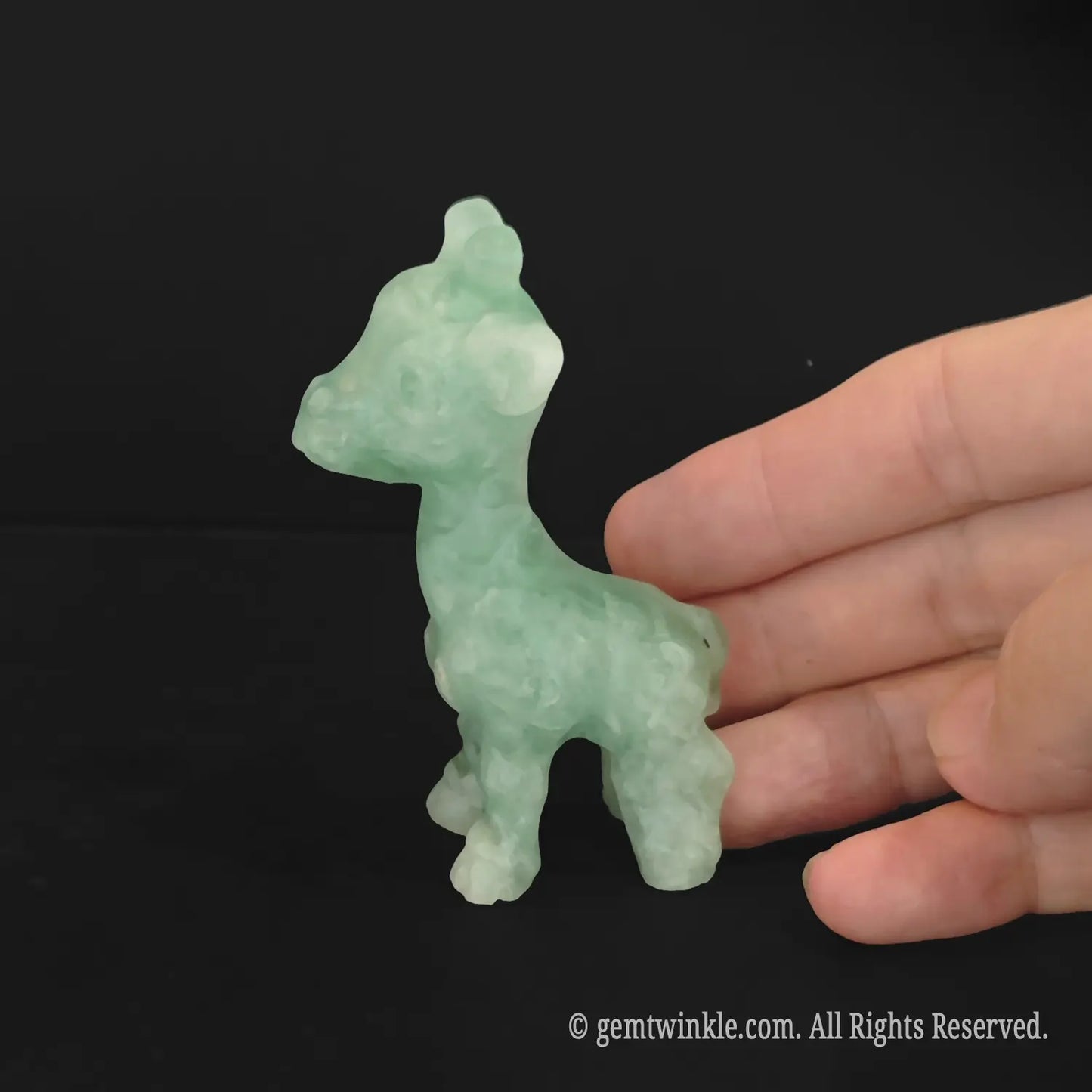 Handheld green stone giraffe figurine