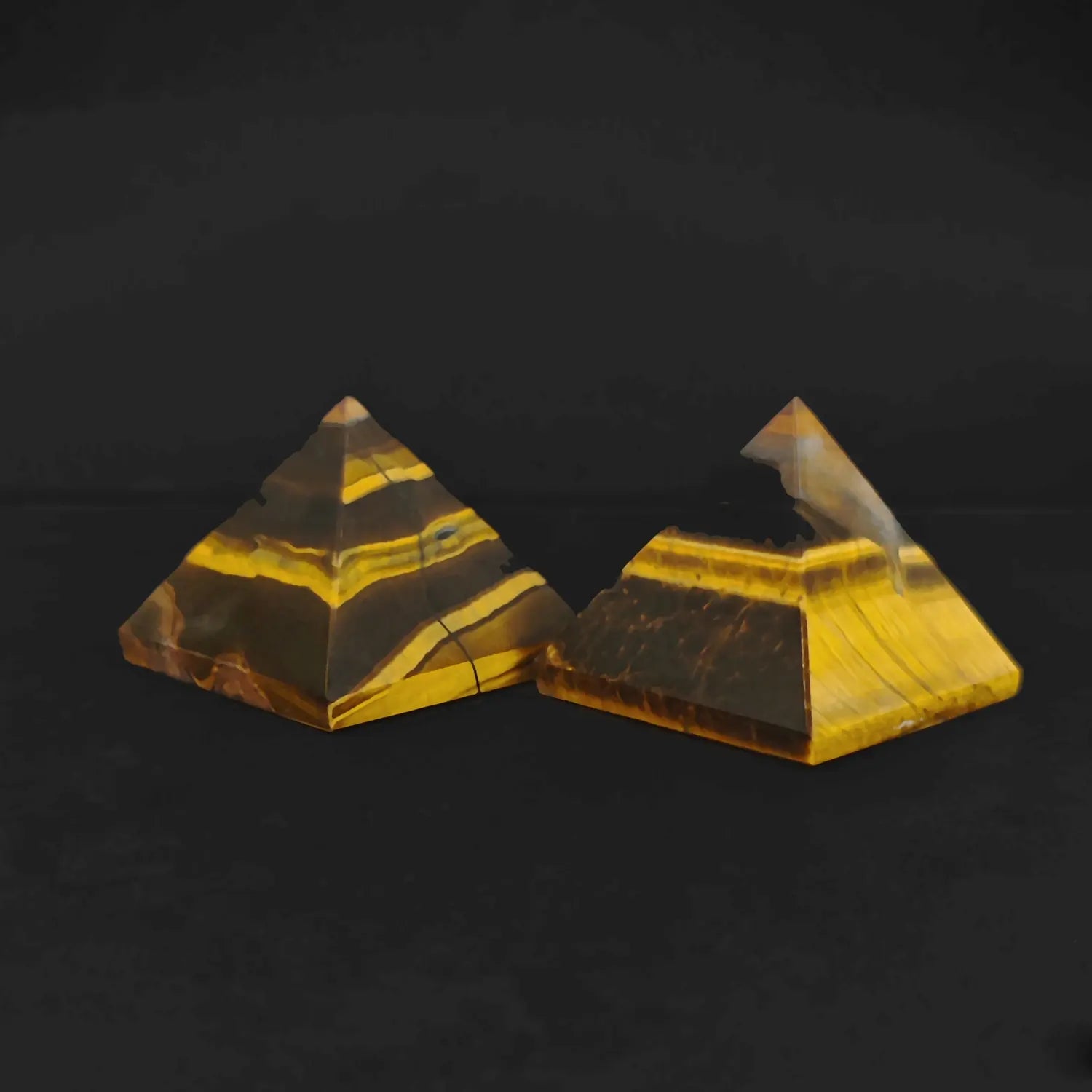 Two natural gold tigers eye pyramids showcasing layered interlocking structure and silky mineral bands as shown in image_284ed1.jpg