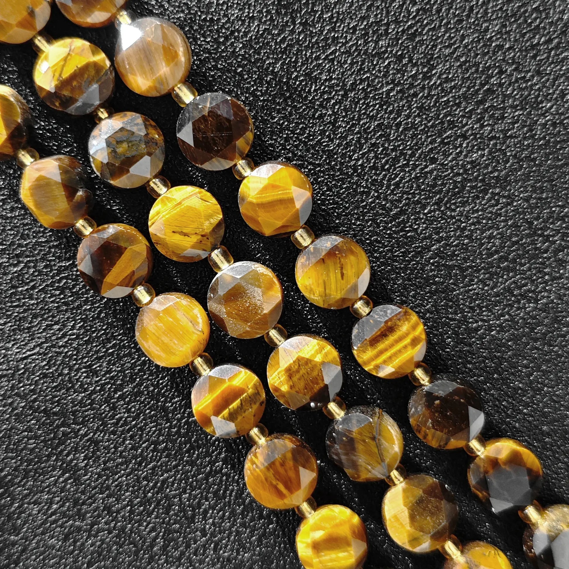 Strands of golden tiger eye hexagram disc beads with star cut facets