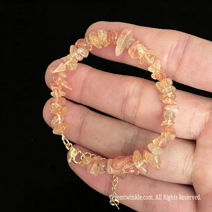 golden sunstone tumbled chip bracelet shown on hand displaying golden shimmer